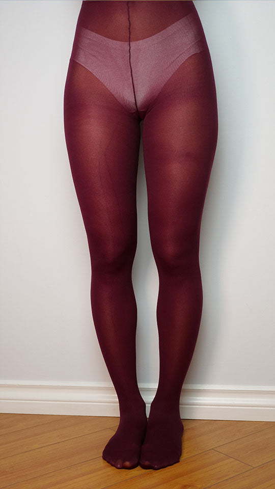  A striking view of burgundy-colored pantyhose, featuring their bold and deep red-purple hue. The rich and vibrant color adds a touch of elegance and flair to any outfit, making them a stylish choice for various occasions.
