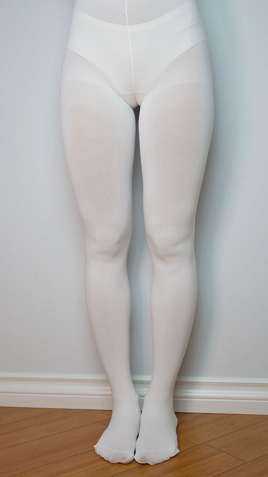 A close-up of white 150D pantyhose, featuring their thicker and more opaque appearance. These pantyhose offer substantial coverage and warmth, making them a cozy choice for colder weather while maintaining a classic white color.